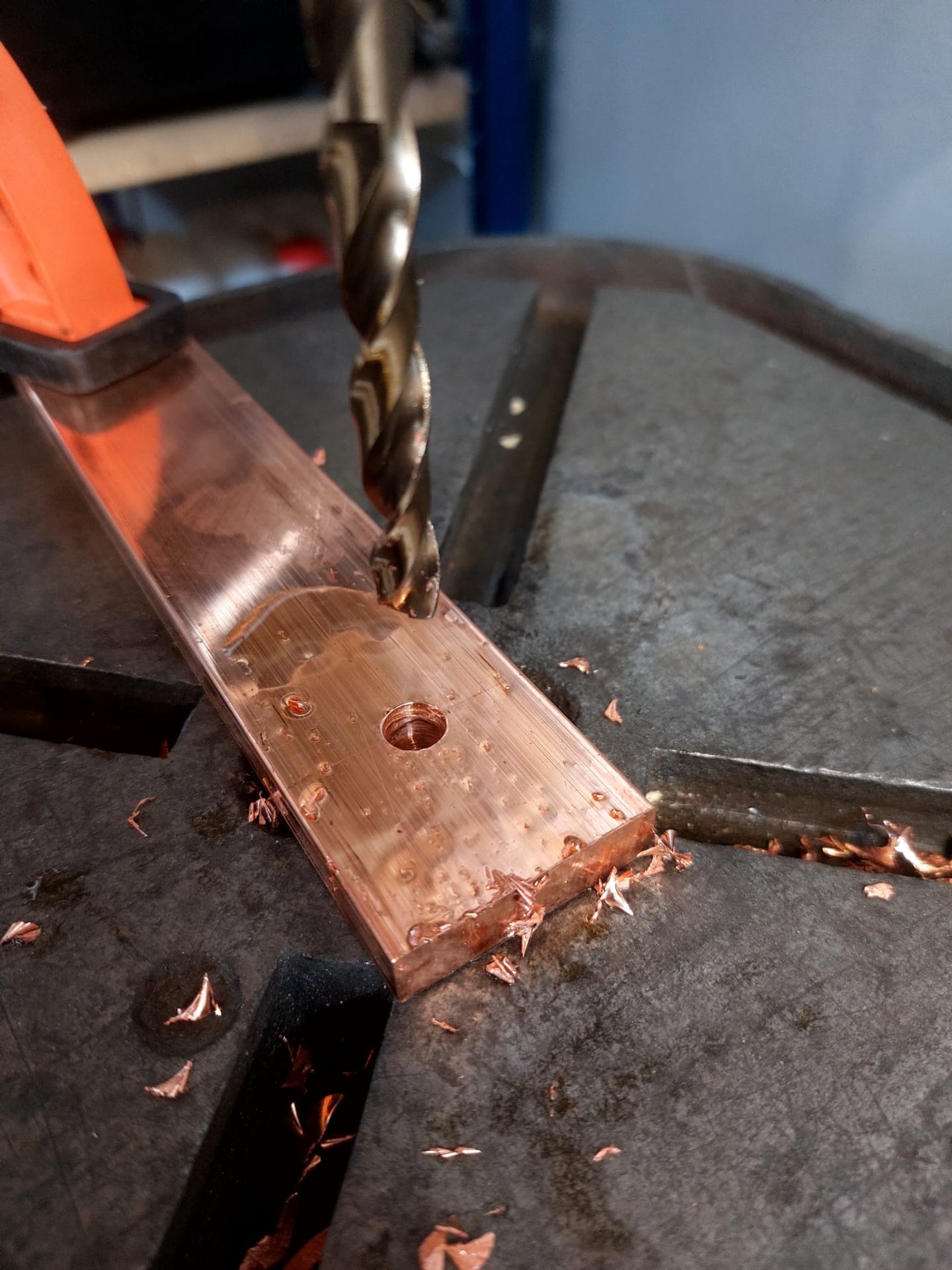 Drilling the busbars to size for the battery rack